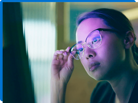 glasses looking at computer to evaluate risk